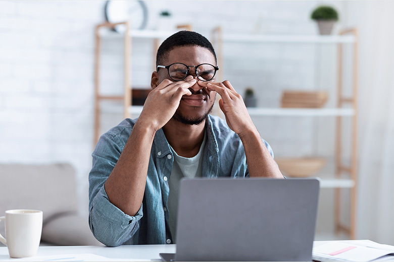 Young Man suffering from myopia